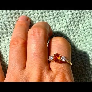 Gold ring with diamond and topaz details